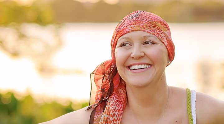 Picture of a woman smiling with a head scarf