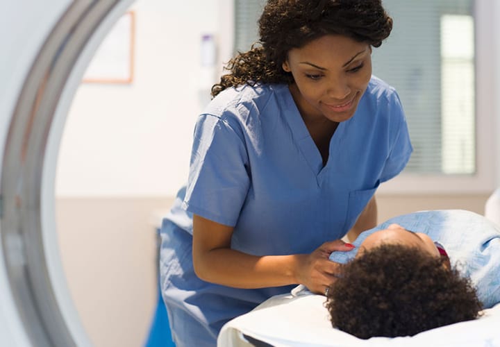 Picture of a nurse and a patient during medical procedure