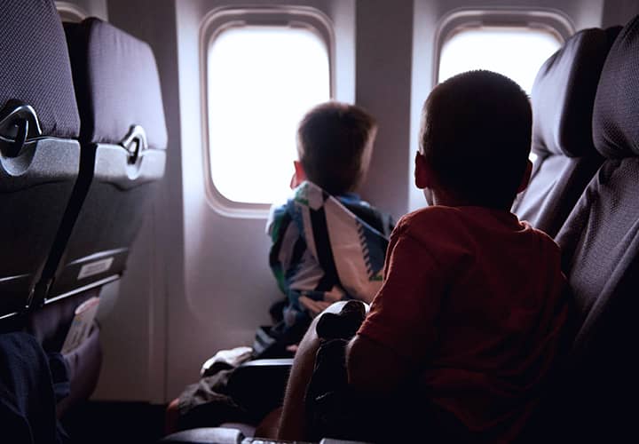 Man and child looking out of aeroplane window