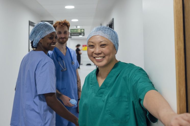 Picture of smiley nurses in the corridor