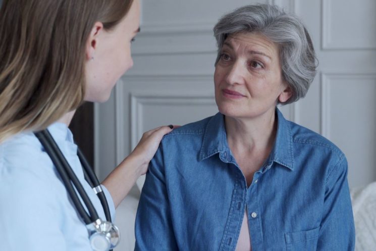 Picture of a doctor speaking to an older woman
