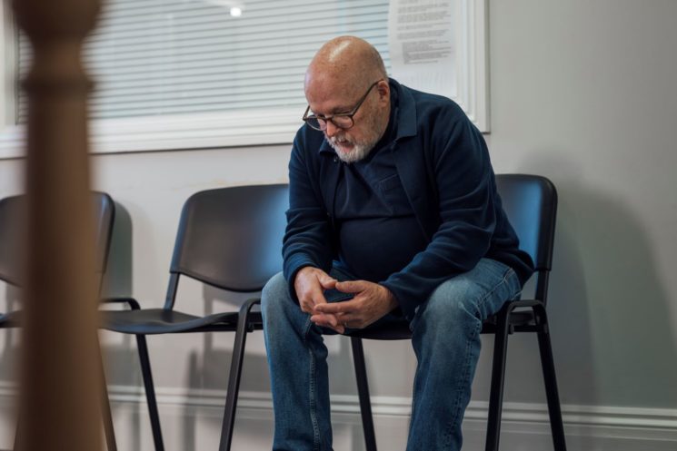 Picture of a man sitting in a waiting room