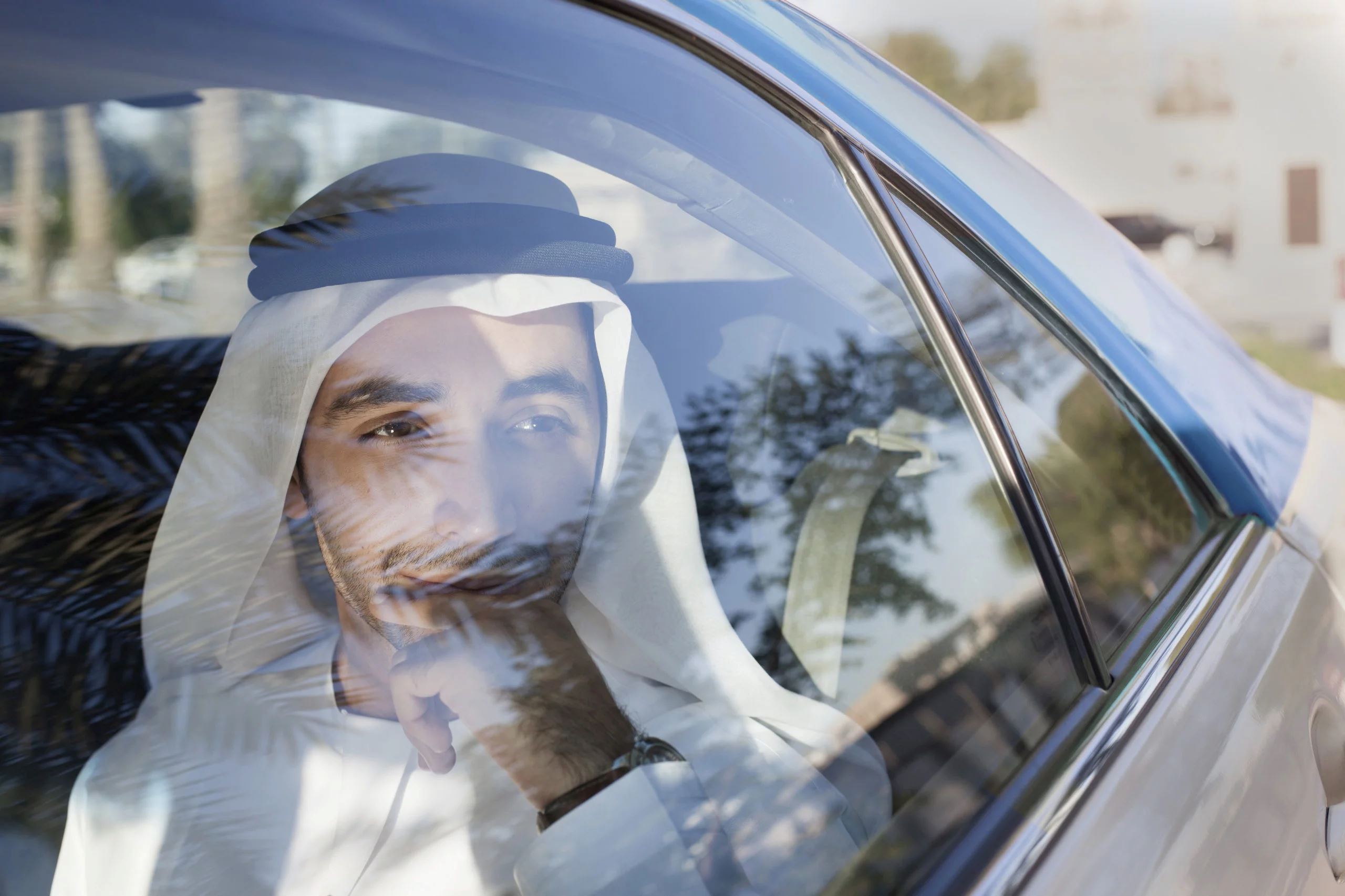 A picture of a muslim man in the car