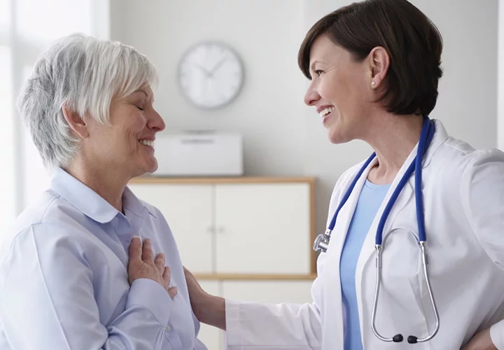 Health professional speaking to her patient