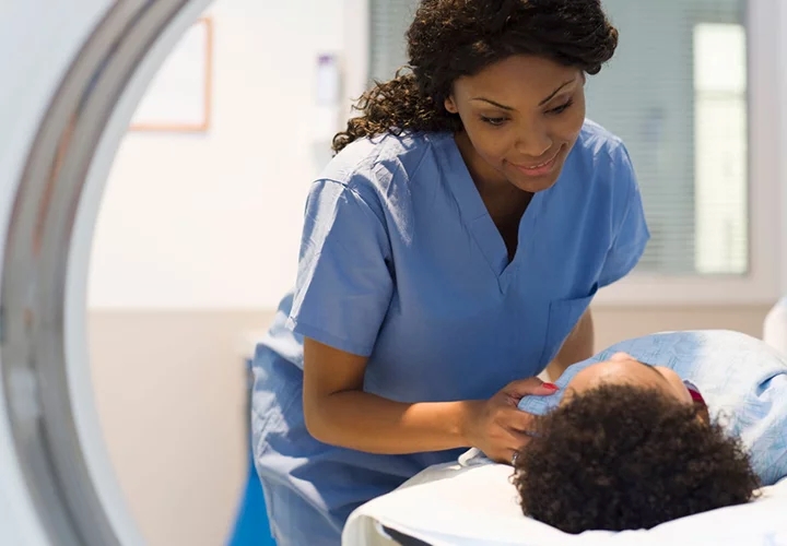 Nurse with the patient performing MRI